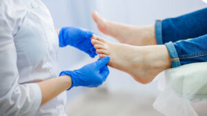 Podiatry doctor examines feet